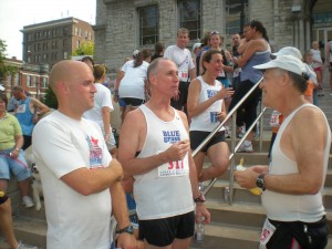 Mike Lesshaft shows off his BLUEgrass emblazoned race singlet to fellow club members.